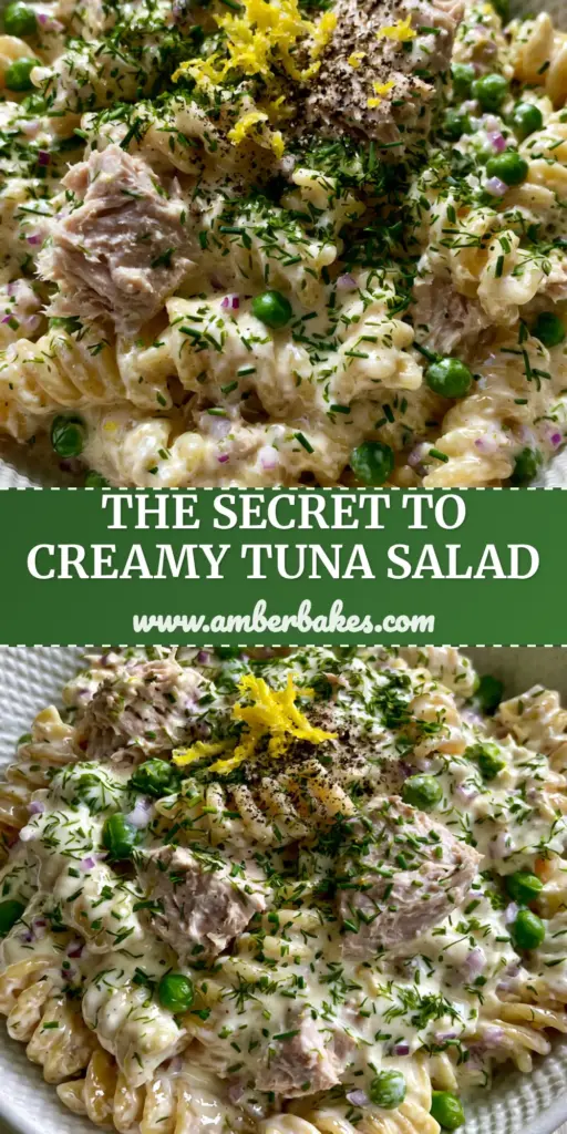 A close-up of a Creamy tuna pasta salad featuring glossy ivory dressing, green peas, and fresh dill in a white bowl.