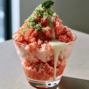 Detailed view of the crystalline fruit fibers in coral-pink Watermelon Shaved Ice.
